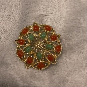 Sarah Coventry Gold Brooch with Red and Green Accents